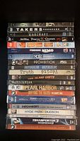 Full stack of 20 sealed DVDs displayed front-facing, showing titles and sealed packaging.