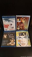 Lot of 4 sealed Blu-ray discs including Fantastic Voyage, The Lion King, Cape Fear, and Lucy.
