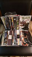 Stack and spread of Blade comic books showing front covers and partial spines.