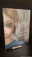 Front cover of Big Eyes book with a close-up image of a girl with big eyes.