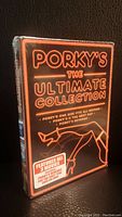Front of the sealed Porky's The Ultimate Collection DVD box showing title and three movies included.