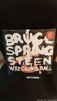 Front of sealed Bruce Springsteen Wrecking Ball double LP with large text on cover.