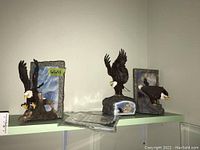 Three eagle figures on shelf showing size and detail, each figure approximately 5x5x7.5 inches.