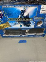 Boxed Lionel Polar Express train set showing front with locomotive, packaging graphics, and claim of rechargeable battery technology.