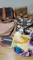 Full lot showing 4 handbags and assorted scarves and hankies
