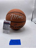 Signed Spalding basketball with Tyrese Maxey's signature and JSA certificate front view