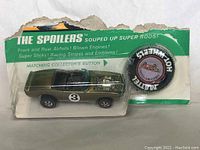 Front view of car in blister on card with button