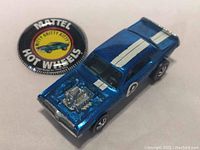 Oblique view of car front and badge together