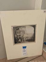 Full view of matted etching in cardboard frame with lot number sticker