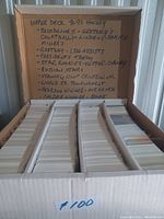 Box with multiple rows of Upper Deck hockey cards from 1992-1993 season with handwritten label listing included categories and players