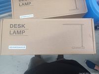 Box of the LED desk lamp with basic illustration and model code GEHM632AWUS.