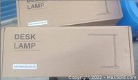 Boxed LED desk lamp packaging with product details and model number GEHM632AWUS