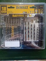 18-piece DEWALT drill bit set in sealed plastic packaging showing drill bits of various sizes in black and gold finish.