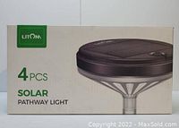 Box packaging showing brand Litom and 4 pcs solar pathway light