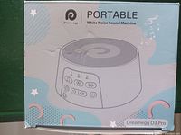 Photo of Dreamegg Portable White Noise Sound Machine in original retail box with product image and branding.