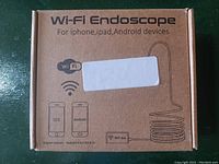 Wi-Fi Endoscope retail box showing compatibility for iPhone, iPad, Android devices with wireless connection.