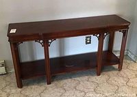 Full view of the wood side table showing top surface, legs, and bottom shelf