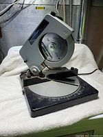 Front side view of the Craftsman compound mitre saw showing the base and saw blade.
