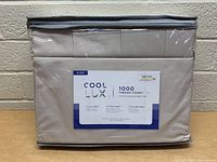 Image of packaged Cool Lux 1000 thread count king sheet set front view showing product label and packaging.