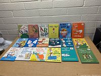 Photo of 18 children’s books by Dr. Seuss and related authors arranged on a table showing front covers and titles.