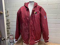 Front view of the Starter NFL Phoenix Cardinals red jacket on a mannequin showing the logo and zipper closure