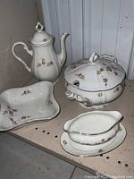 Full set of Winterling Marktleuthen Bavaria serving pieces on shelving: large coffee pot, soup tureen with lid, sauce boat with platter, square vegetable bowl