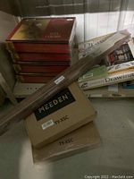 The lot with four sealed Artists Way painting kits by Julia Cameron stacked, Complete Drawing Kit, Meeden paint kits boxes, and wooden easel boxed.