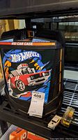 Plastic rolling storage case for Hot Wheels labeled '101 Car Case' with a red car illustration