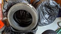 Four Michelin Green X-Ice snow tires, size 225/60 R18 400 H, wrapped in plastic and stored in garage.