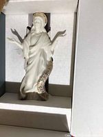 Boxed Lenox porcelain angel figurine with detailed floral and gold trim.