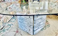 Oval glass top and marble base full view