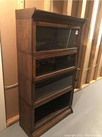 Front angled view showing overall structure of oak barrister bookcase