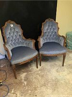 Pair of matching armchairs shown side by side