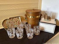 Full set showing ice bucket, drink glasses, snack trays, and cat glasses on boxes