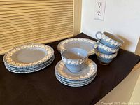 Overview showing two 9" plates, four 8" plates, four saucers and four teacups arranged on table