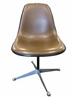 Front view of brown vinyl seat on metal star base