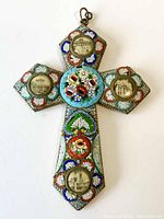 Italian mosaic glass cross with small photos of Vatican buildings set in circular frames on each arm, colorful floral mosaic centerpiece.