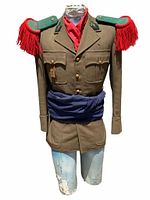 Full front view of WWII French Foreign Legion uniform on mannequin showing jacket, epaulets with red fringes, red scarf, and blue cummerbund