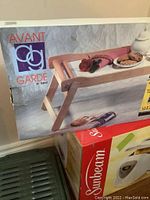 Box of Avant Garde natural wood folding tray by Target showing product logo and wood tray design.