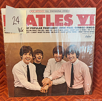 Front cover photo of Beatles VI album showing all four band members and grading sticker.