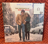 Front cover of The Freewheelin' Bob Dylan vinyl LP record with grading sticker VG+ visible.