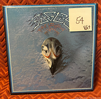 Eagles Greatest Hits album cover with bird skull artwork and price note indicating $54.