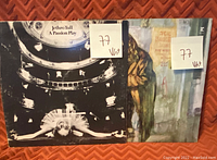 Two Jethro Tull vinyl record album covers side by side showing grading stickers with '77 Vht'.