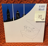 Vinyl record album cover for Joe Jackson's Night and Day with grading note '73 NM' attached to the front.