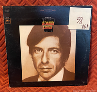 Front cover of 'Songs of Leonard Cohen' vinyl record album showing artist portrait and condition label VG+
