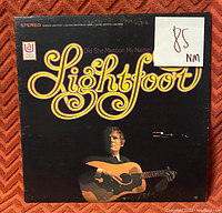 Front cover of Gordon Lightfoot's 'Did She Mention My Name?' vinyl LP record with grading sticker showing near mint condition.