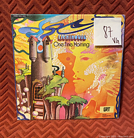 Photo of the vinyl record album cover 'One Fine Morning' by Lighthouse with VG condition rating sticker present on front.