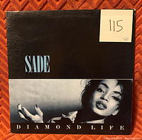 Front cover of 'Diamond Life' by Sade vinyl record showing album artwork and condition