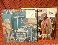 Woodstock Twofer album fronts with two vinyl records visible in sleeves, both graded VG on sticker labels