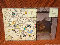 Photo of two Led Zeppelin albums, Led Zeppelin III and Led Zeppelin IV, each with a media grade of 82.